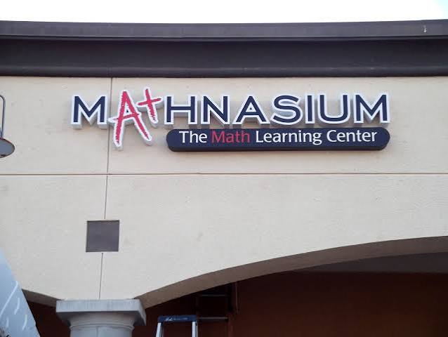 Non-lit dimensional letters and logo on an interior wall