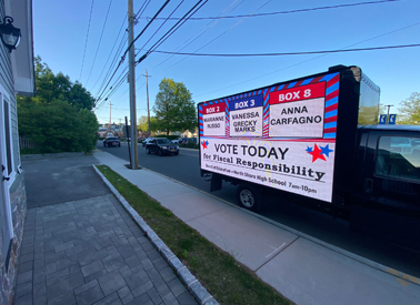 Weekly LED billboard truck rental driving through Tampa Bay